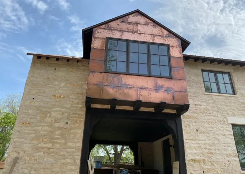 Copper metal panel facade on a stone building for Metal Roof Coating in Mendota Heights