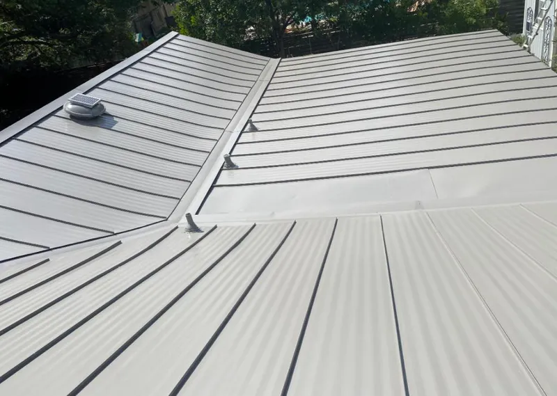 Solar attic fan installed on a metal roof for Roof Ventilation in Mendota Heights