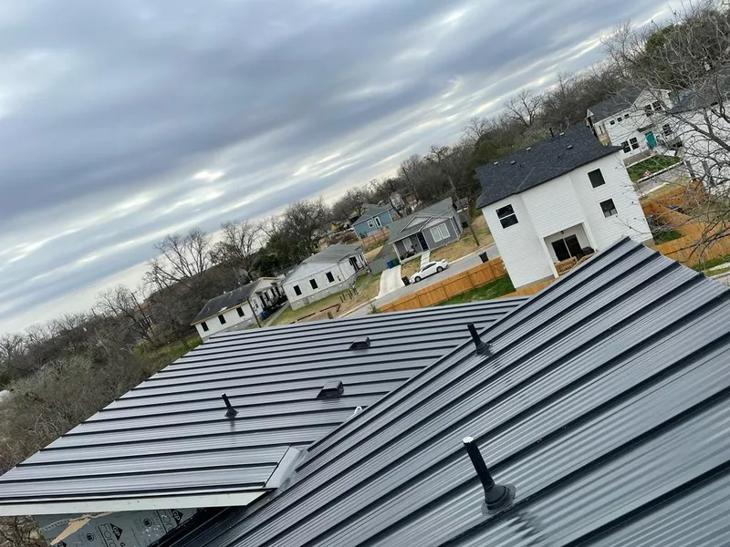 Standing seam metal roof panels with vents for Skylight Repair in Mendota Heights